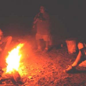 Campfire circle and fire blessing ceremony with Navajo leader in Canyon de Chelly.