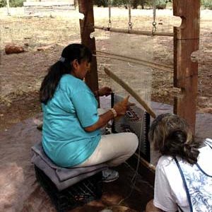 Navajo weaver in Canyon de Chelly. This represents creative focus, and attunement with nature in the pattern she is weaving