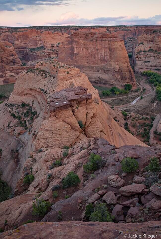 Sandstone formations of red-walled Canyon de Chelly, one of Navajo places to connect with their Holy Ones.