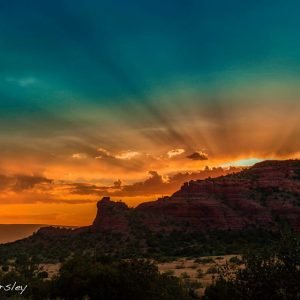 Sedona sunset over cliff silhouette invites connection with the spiritual energies of sunset, moonrise and stars.